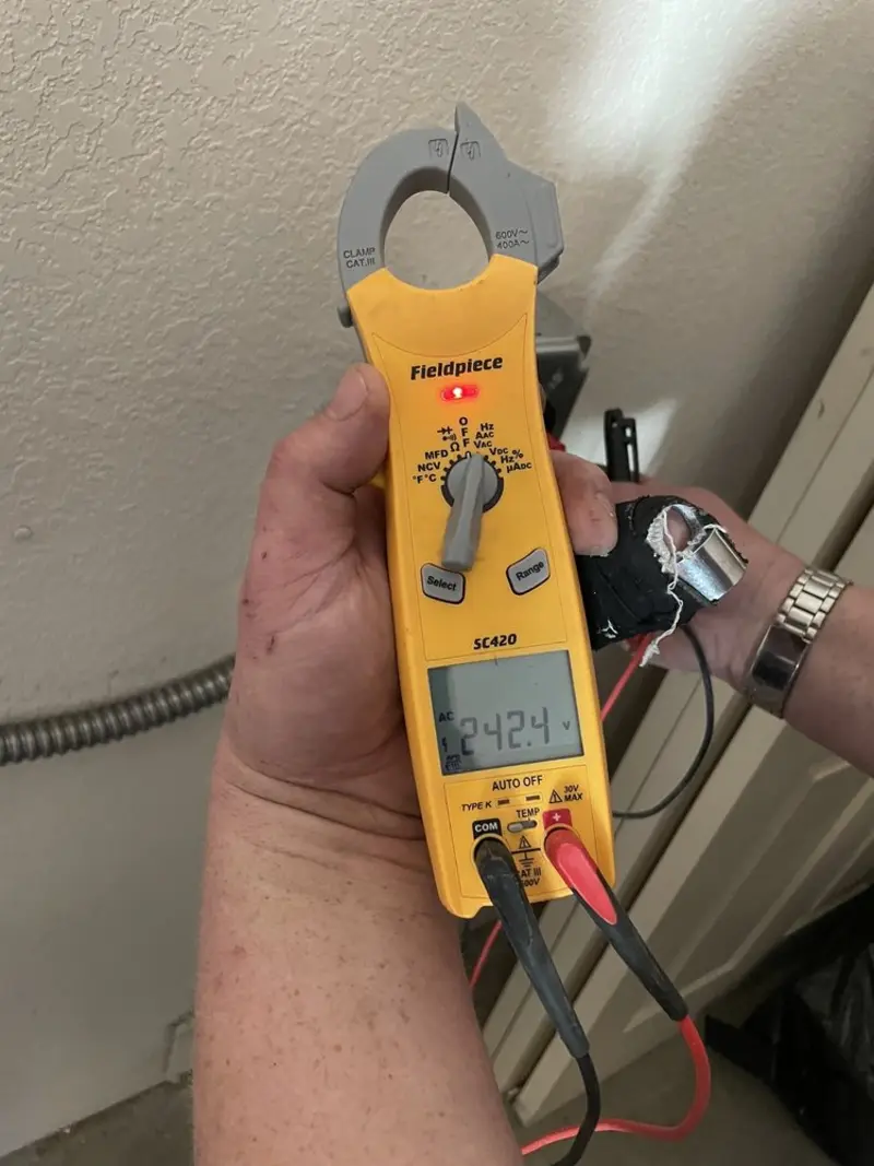 Voltage testing with clamp meter during Outlet Installation in Southampton